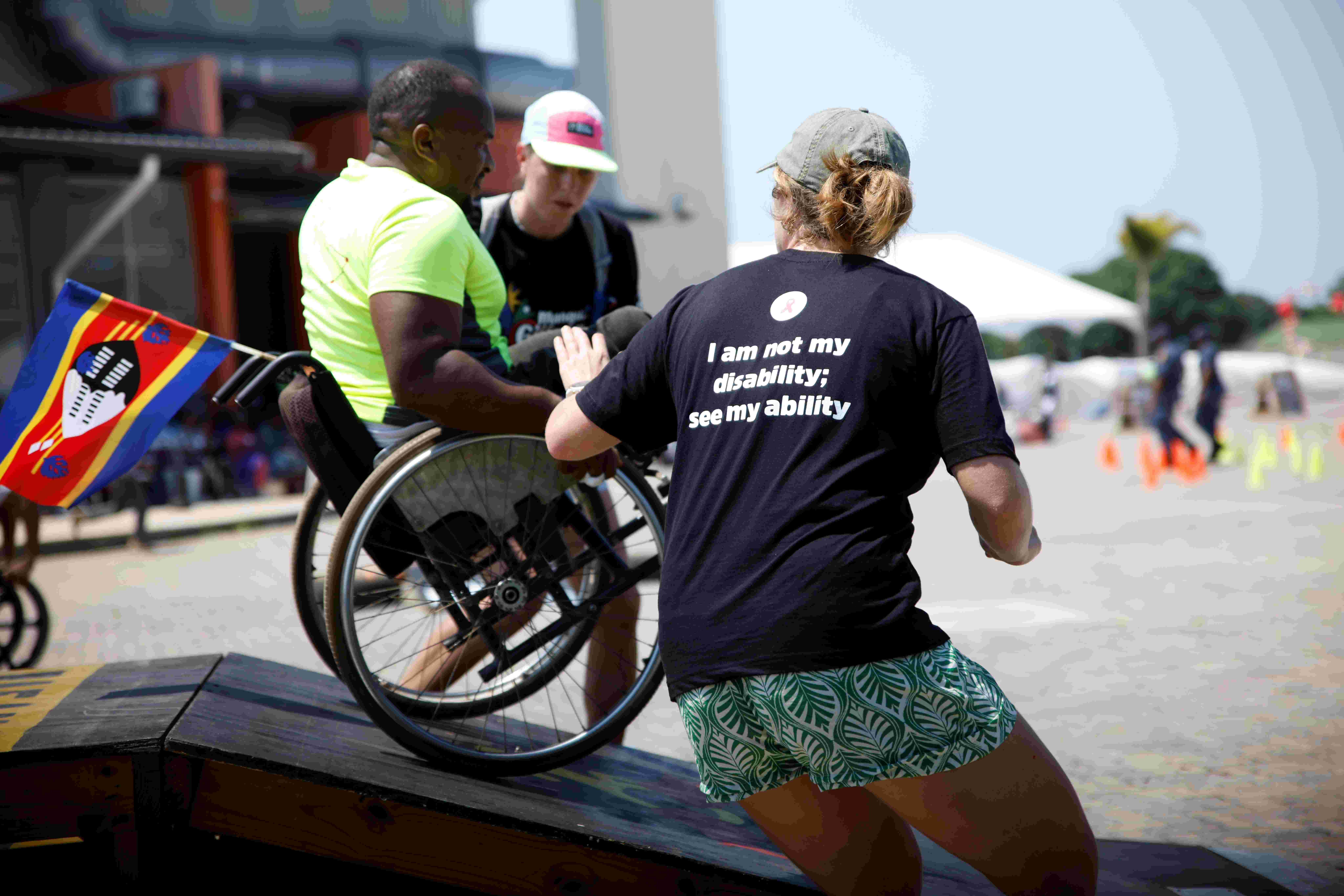 Wheelchair athlete navigating the MedBull technical challenge course at Manguzi Gijima